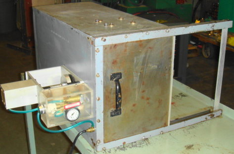 Small bench-top explosive process blast chamber with remote pne