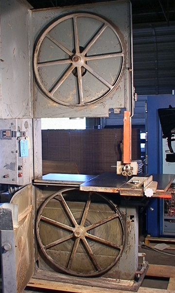 Note the table tilt drive and blade tension indicator in the images 