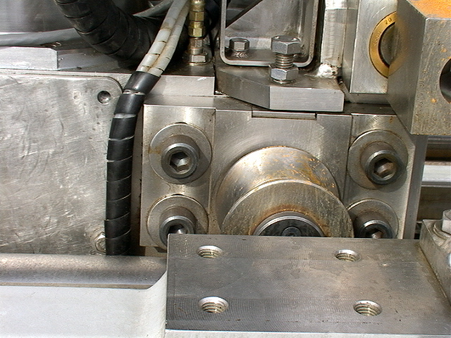 the roller in the image above not stainless is one of 8 that clamp the 